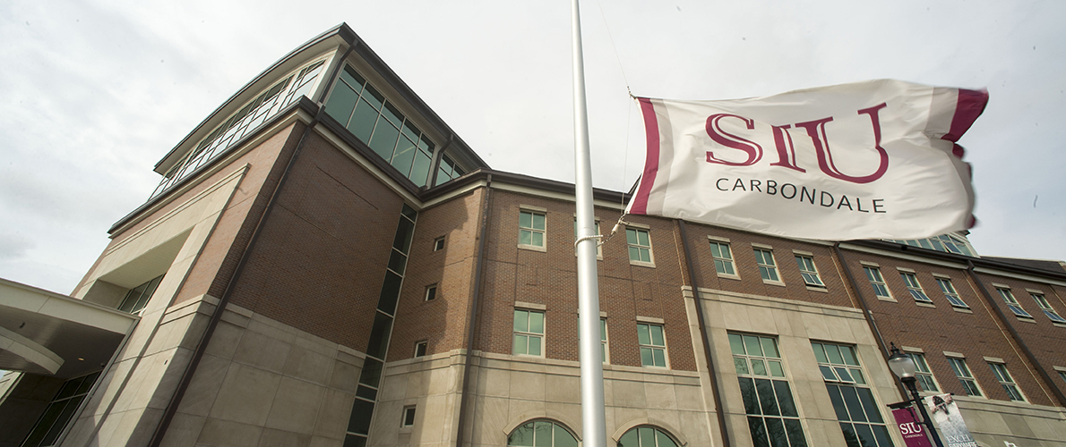 southern Illinois university Carbondale flag in front of student services building